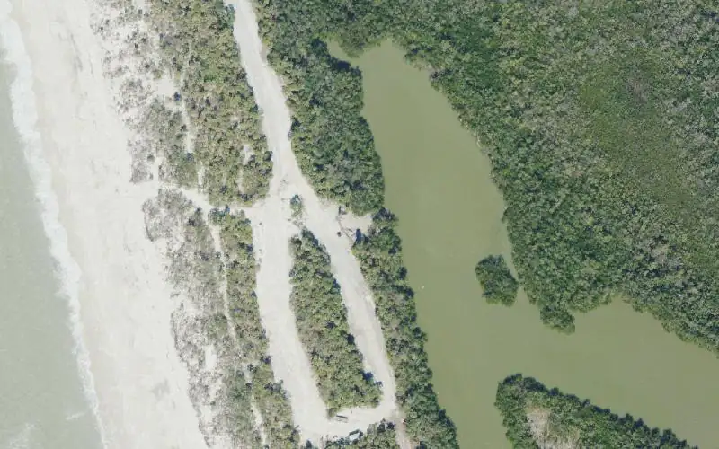 Aerial photo of the area around Barefoot Beach Preserve & Park Canoe/Kayak Launch, Collier County